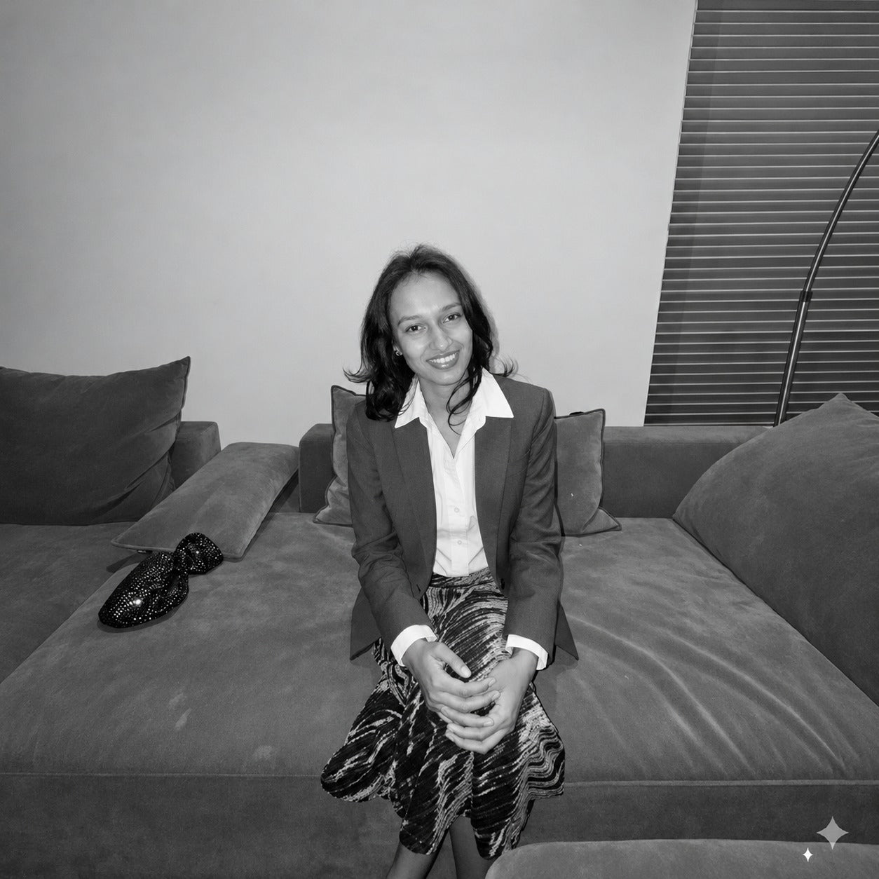 SORAA founder seated on a sofa