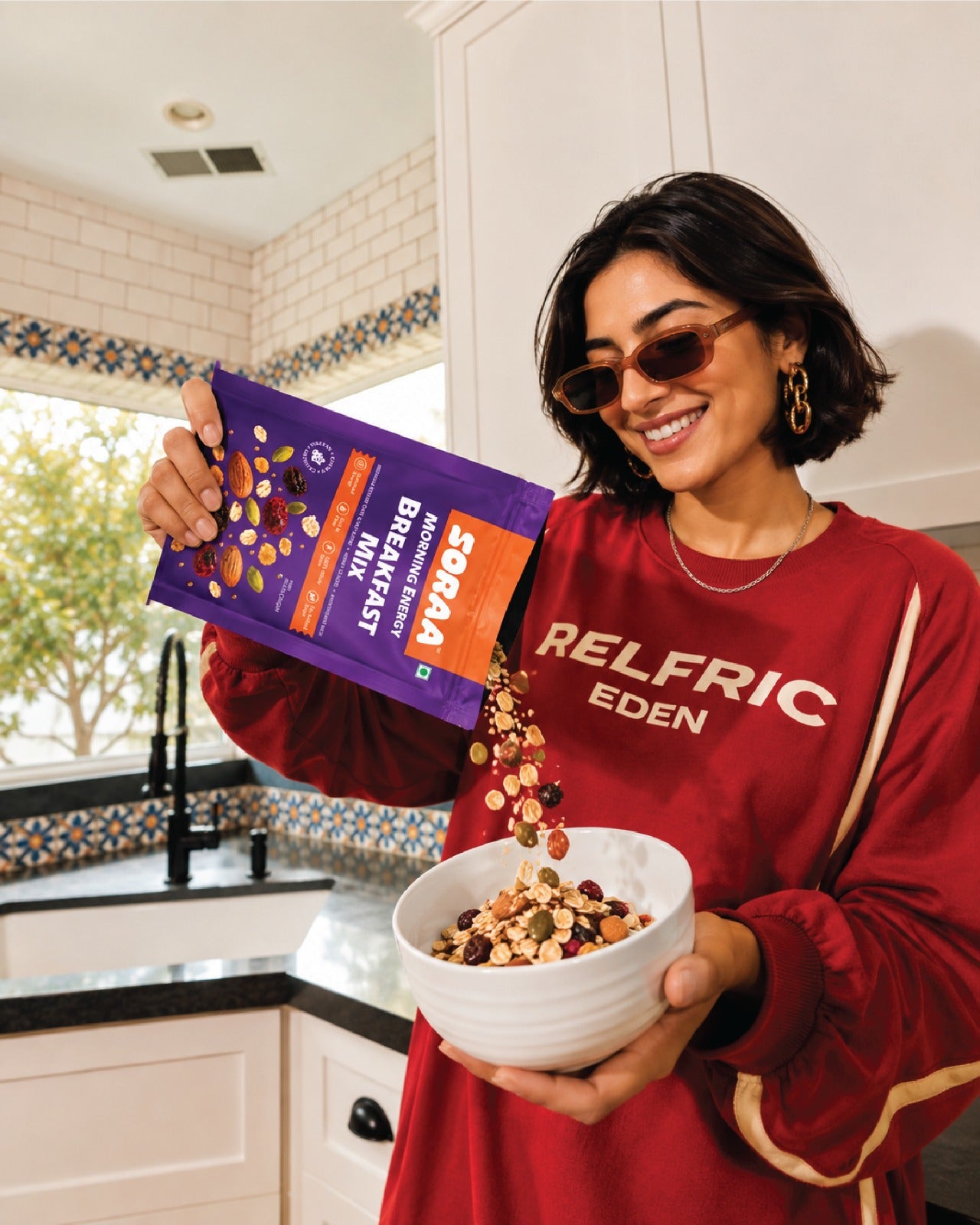 Woman pouring SORAA Breakfast Mix into a bowl